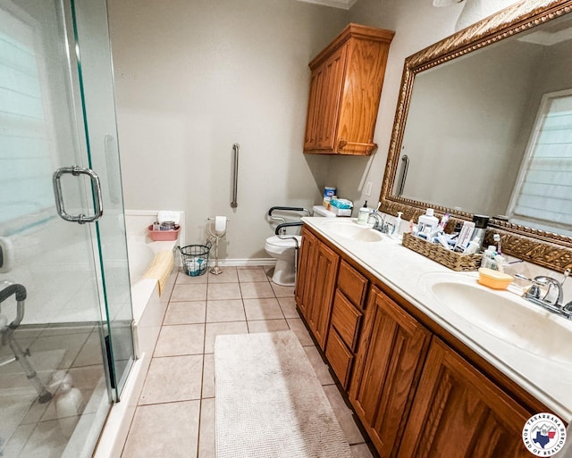 25 County Road 1905, Linden, TX 75563 - bathroom with a shower stall, toilet, double vanity, a tub, and tile patterned flooring