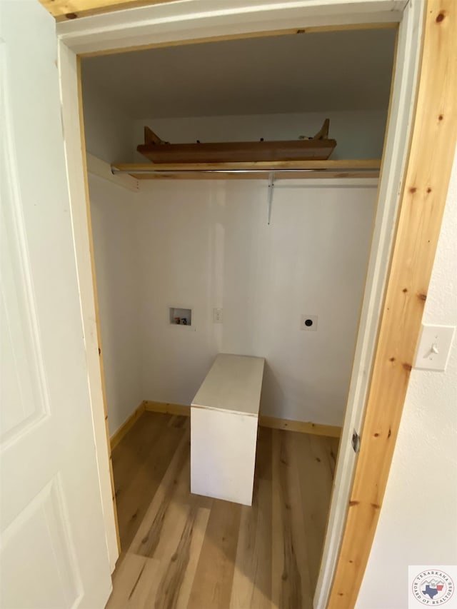 laundry room featuring light hardwood / wood-style floors, hookup for a washing machine, and electric dryer hookup