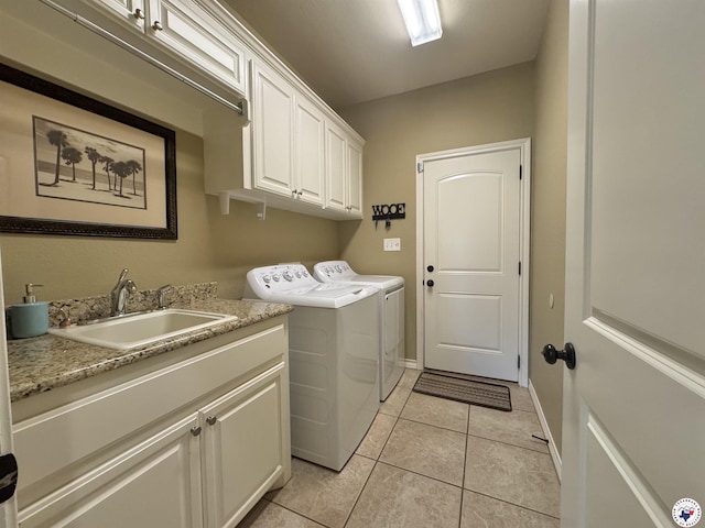 22 Heritage Blvd, Texarkana, TX 75501 - laundry area featuring cabinet space, washer and dryer, and light tile patterned flooring