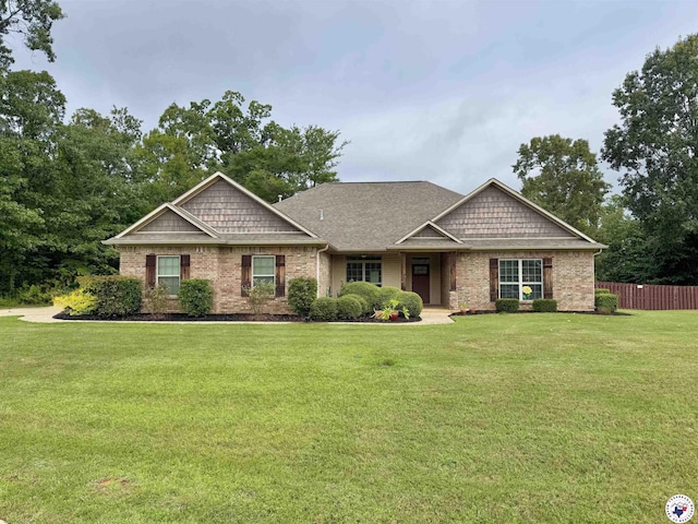 22 Heritage Blvd, Texarkana, TX 75501 - craftsman-style house featuring brick siding and roof with shingles