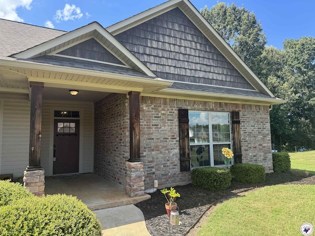 22 Heritage Blvd, Texarkana, TX 75501 - view of front facade with roof with shingles and brick siding