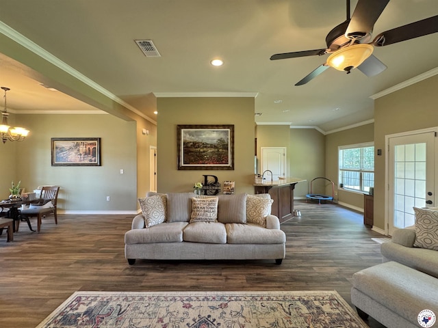 22 Heritage Blvd, Texarkana, TX 75501 - living area with dark wood finished floors, a chandelier, recessed lighting, crown molding, and a ceiling fan