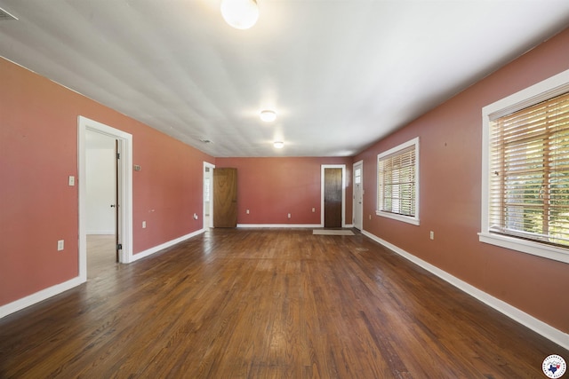 6008 E 9th St, Texarkana, AR 71854 - empty room featuring dark wood finished floors and baseboards