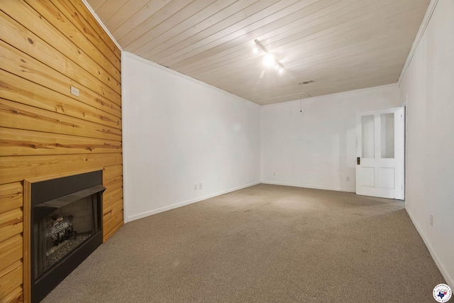 6008 E 9th St, Texarkana, AR 71854 - unfurnished living room with attic access, carpet floors, a fireplace, and wood ceiling