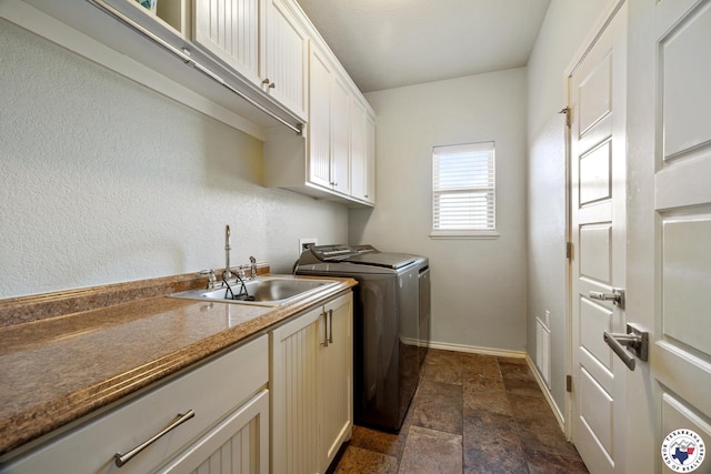 14 Lone Star Pkwy, Texarkana, TX 75503 - washroom featuring cabinet space, dark stone finish flooring, and washing machine and dryer
