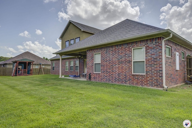 14 Lone Star Pkwy, Texarkana, TX 75503 - back of house featuring brick siding, a shingled roof, and a patio area