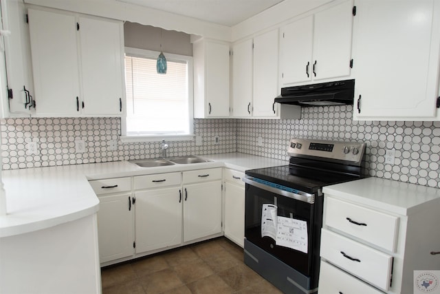 kitchen with stainless steel electric stove, sink, decorative backsplash, and white cabinets