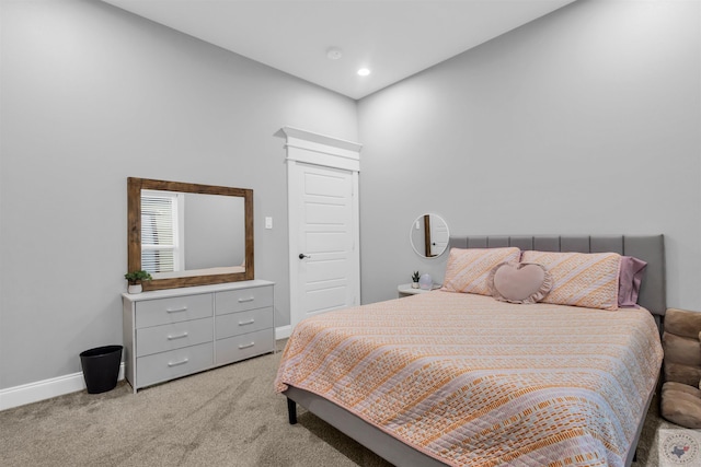 bedroom with light colored carpet