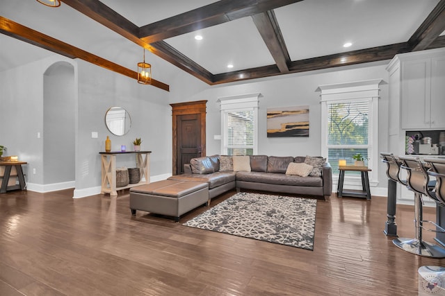 living room featuring dark hardwood / wood-style flooring, beam ceiling, and coffered ceiling