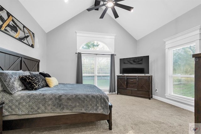 bedroom with ceiling fan, multiple windows, lofted ceiling, and carpet floors