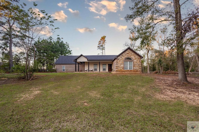 view of front of property with a lawn