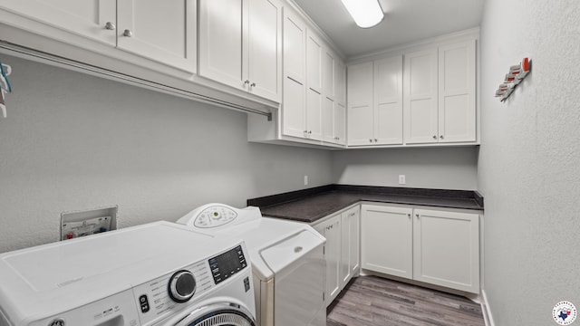 155 Lillian Ln, Texarkana, TX 75501 - washroom featuring washer and clothes dryer, cabinet space, wood finished floors, and a textured wall