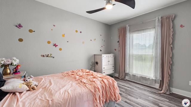 155 Lillian Ln, Texarkana, TX 75501 - bedroom featuring wood finished floors and a ceiling fan