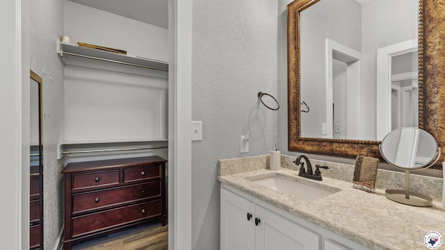 155 Lillian Ln, Texarkana, TX 75501 - bathroom with vanity and wood finished floors