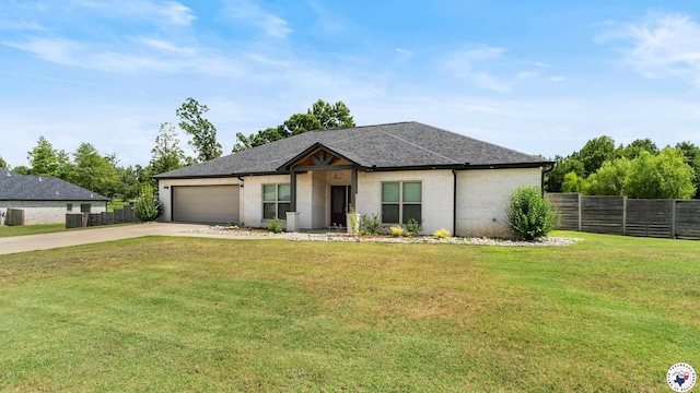 155 Lillian Ln, Texarkana, TX 75501 - view of front of property with driveway, a garage, a shingled roof, and brick siding