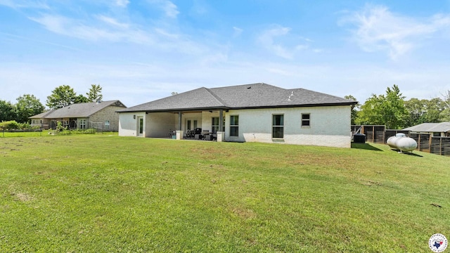 155 Lillian Ln, Texarkana, TX 75501 - rear view of property featuring a patio, a yard, and ceiling fan