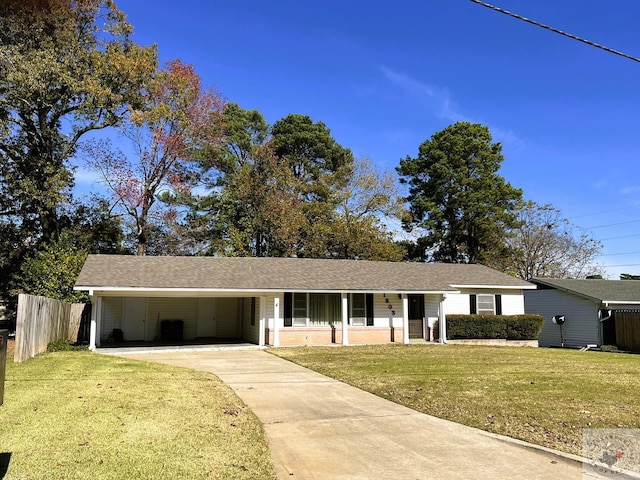 ranch-style house featuring a front yard and a carport