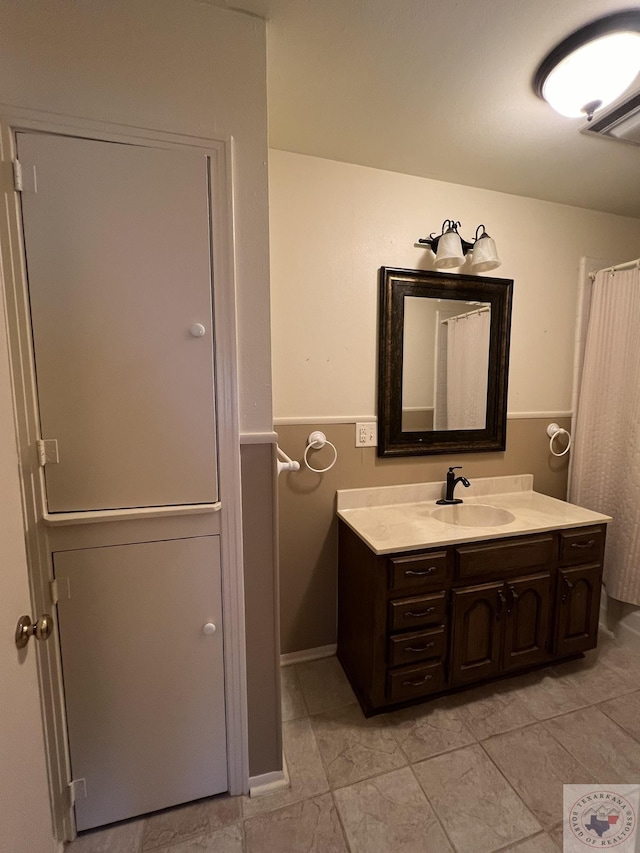 bathroom featuring tile patterned floors and vanity