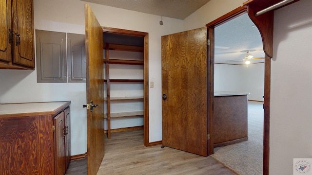 corridor with light hardwood / wood-style floors