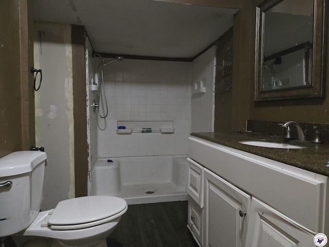 2015 W 14th St, Texarkana, TX 75501 - full bath featuring toilet, vanity, a shower, and wood finished floors