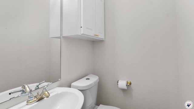 5906 Winchester Dr, Texarkana, TX 75503 - half bath with a sink and toilet
