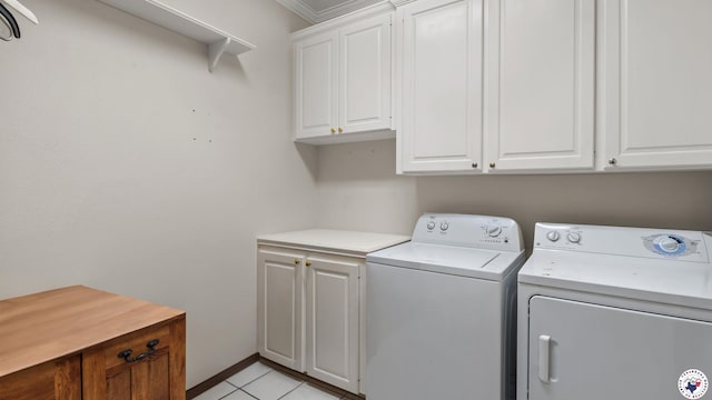 5906 Winchester Dr, Texarkana, TX 75503 - laundry area featuring cabinet space, washer and dryer, and light tile patterned flooring