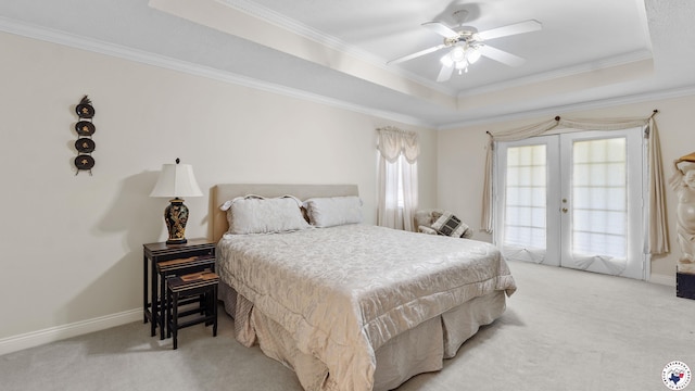 5906 Winchester Dr, Texarkana, TX 75503 - bedroom featuring a tray ceiling, light colored carpet, crown molding, french doors, and a ceiling fan