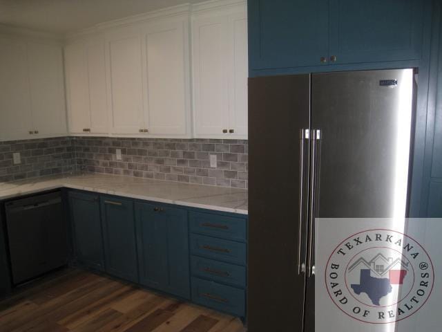 kitchen with white cabinets, dishwasher, high end refrigerator, and tasteful backsplash