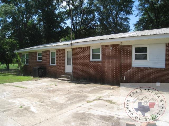 back of house with a patio area