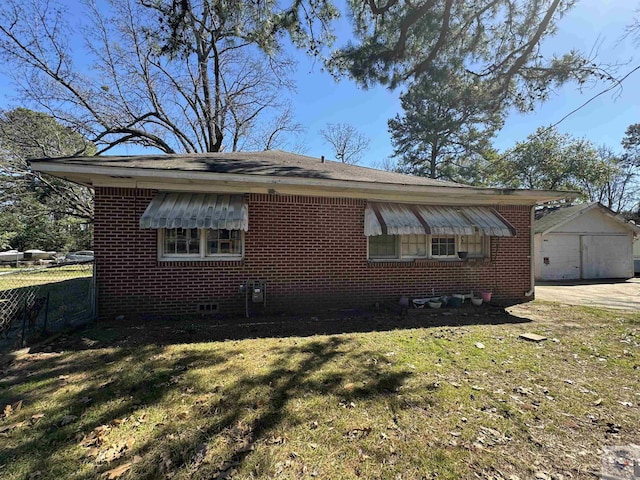 view of side of home featuring a yard