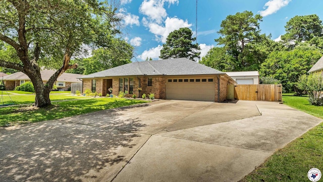 509 Brown Dr, Wake Village, TX 75501 - ranch-style house with concrete driveway, an attached garage, and brick siding