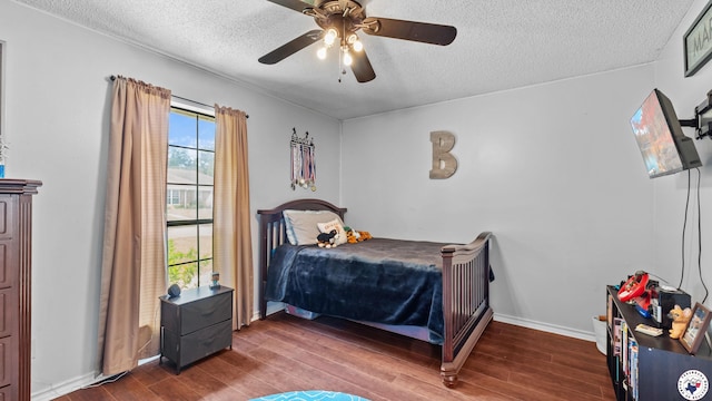 509 Brown Dr, Wake Village, TX 75501 - bedroom featuring a textured ceiling, wood finished floors, and ceiling fan