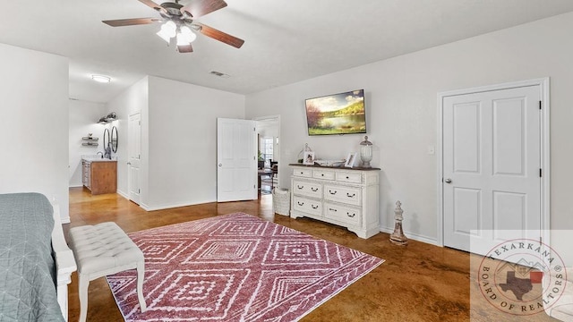 bedroom with baseboards, visible vents, a ceiling fan, ensuite bathroom, and a sink