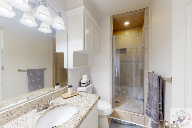 bathroom featuring vanity, toilet, a notable chandelier, and a shower with shower door