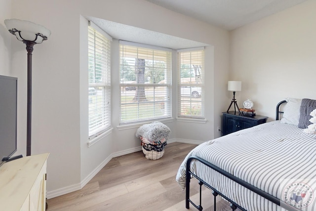 bedroom featuring light wood-type flooring