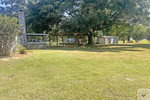 view of yard featuring a storage unit