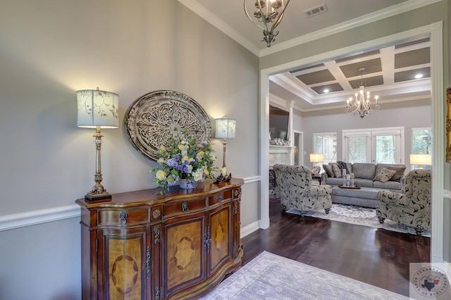 interior space with crown molding, an inviting chandelier, dark hardwood / wood-style floors, beam ceiling, and coffered ceiling