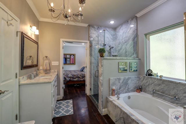 bathroom with independent shower and bath, wood-type flooring, a chandelier, ornamental molding, and vanity