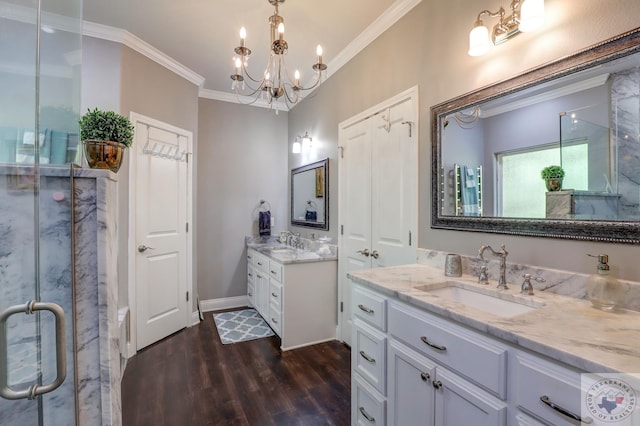 bathroom with hardwood / wood-style floors, an enclosed shower, vanity, an inviting chandelier, and crown molding