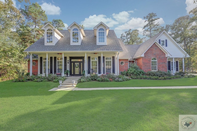 cape cod home with a porch and a front yard