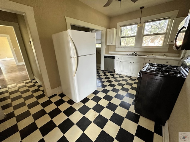 kitchen with black appliances, ceiling fan, white cabinets, and sink