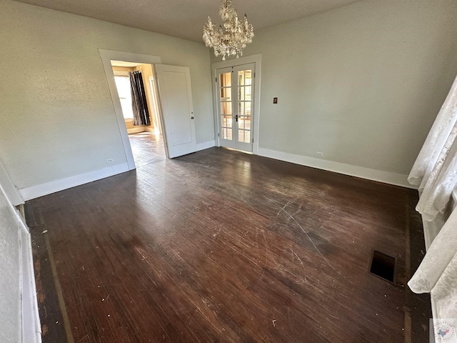 interior space with french doors, a healthy amount of sunlight, and dark wood-type flooring