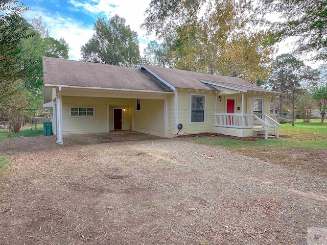 ranch-style home with a carport