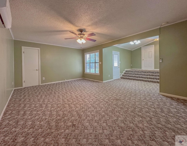 carpeted spare room with ceiling fan, a textured ceiling, lofted ceiling, and crown molding