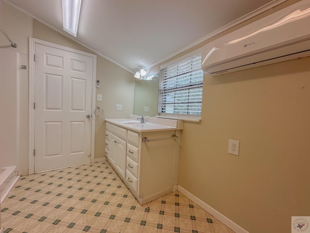 bathroom with crown molding, a wall unit AC, lofted ceiling, and vanity