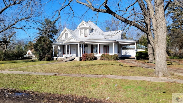 cape cod house featuring a front yard and a porch