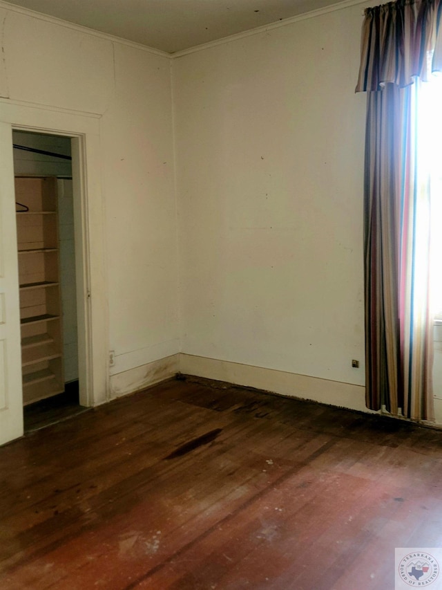 unfurnished room with dark hardwood / wood-style floors