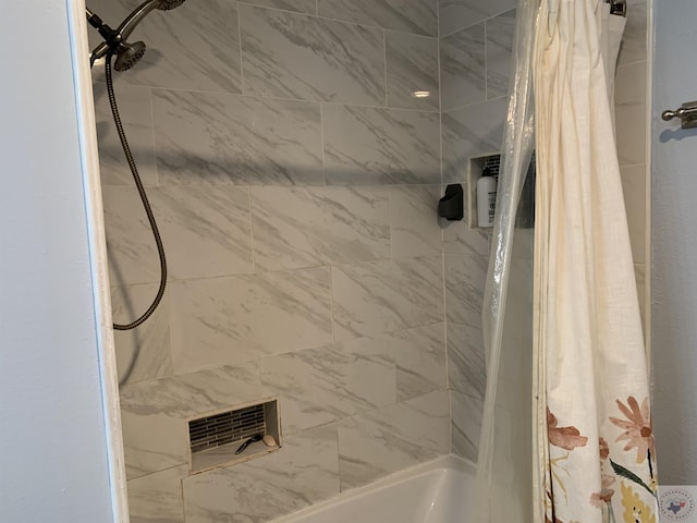 bathroom with shower / tub combo