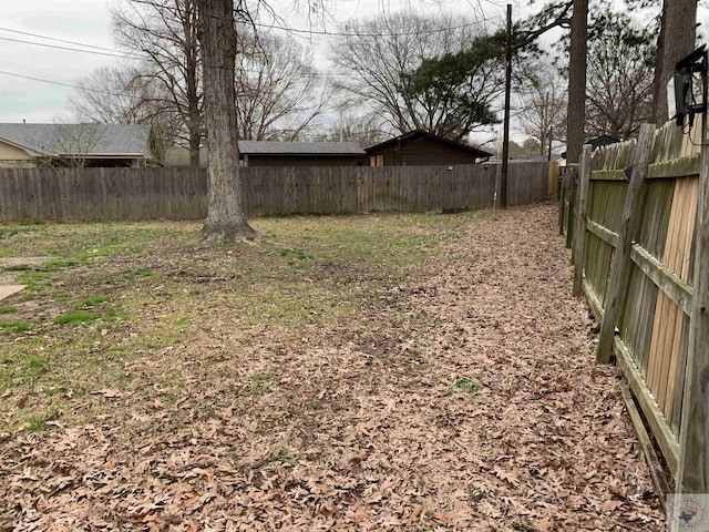 view of yard featuring a fenced backyard