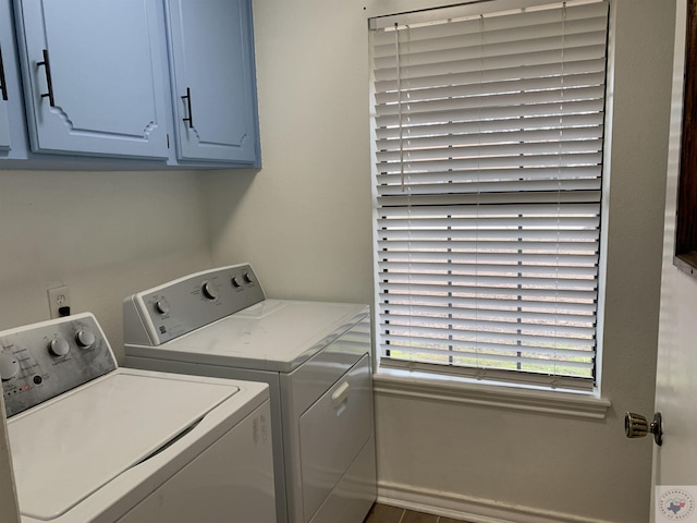 washroom with washer and dryer and cabinet space